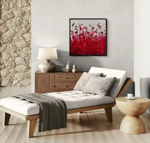 Aro Élan vital painting displayed on a grey wall above a linen daybed