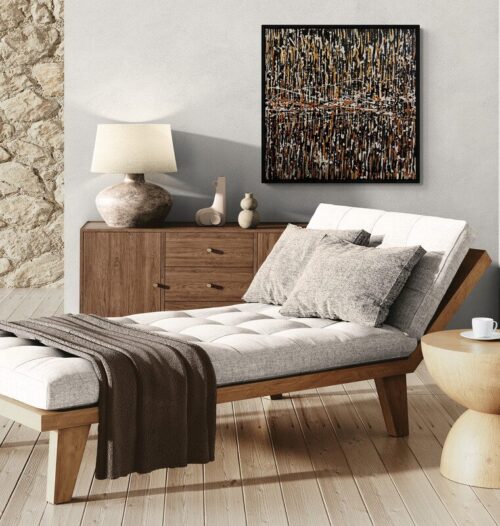 Aro Le grand frisson painting displayed on a stone wall above an oatmeal linen chaise