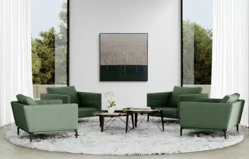 Aro Le messager large abstract painting displayed on a pale grey wall above sage green armchairs