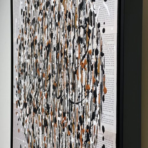 Close-up detail of Le pouvoir des mots by Aro showing black and copper drips over legible vintage book text