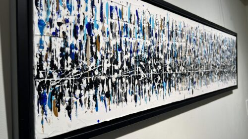 Close-up angled detail of Reflet du monde by Aro showing raised drips of blue, black and white acrylic