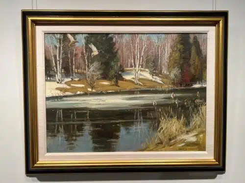 Spring Thaw Mallards by Frank Panabaker shown in a gold and black gallery frame with an ivory mat