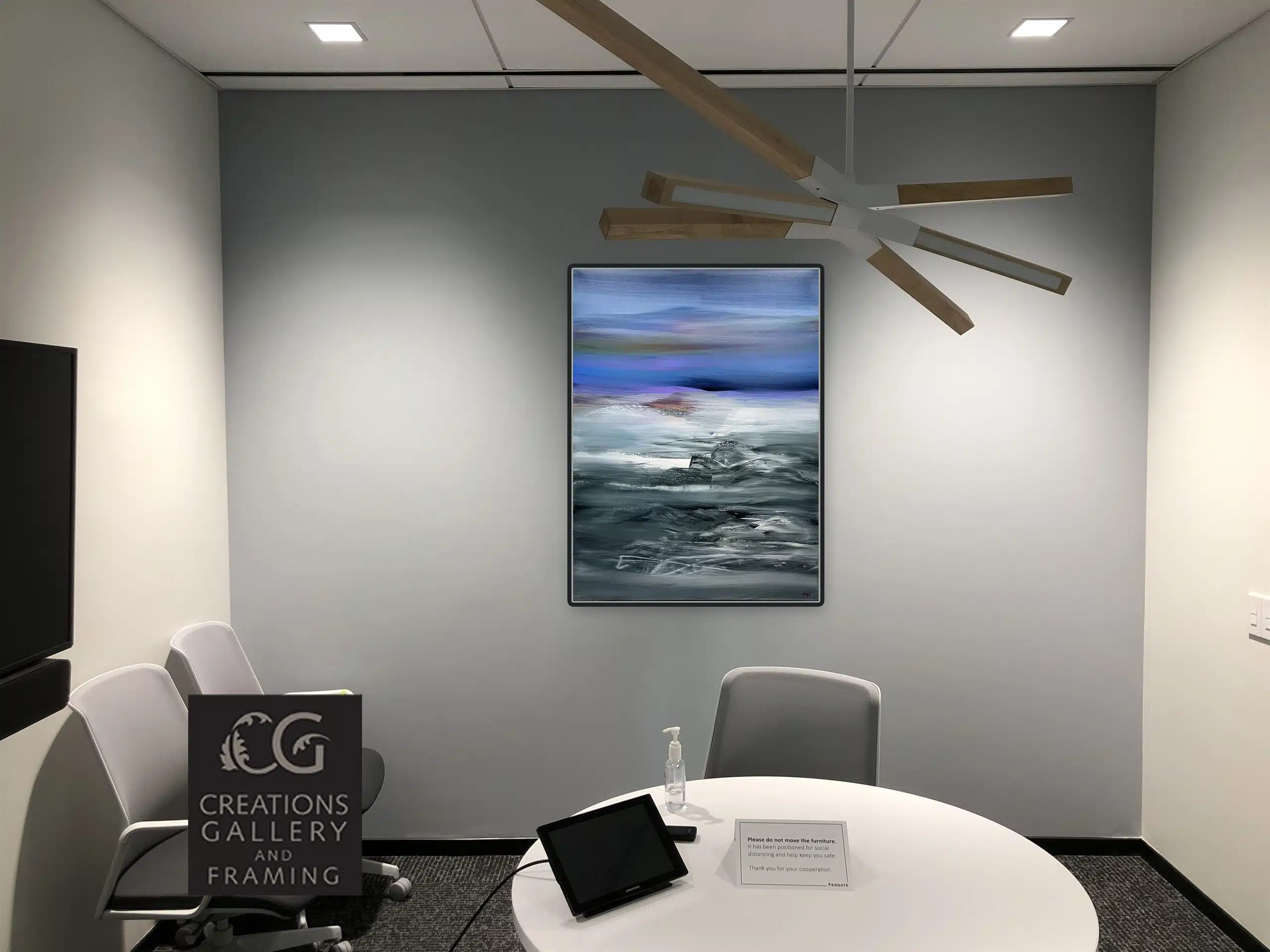 Phantom Realm by Patricia Gagic displayed on the wall of a modern office meeting room