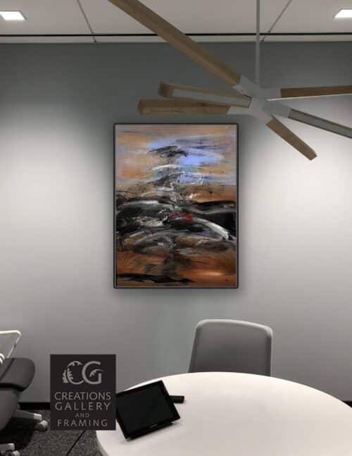 The Journey by Patricia Gagic displayed on the wall of a modern office meeting room
