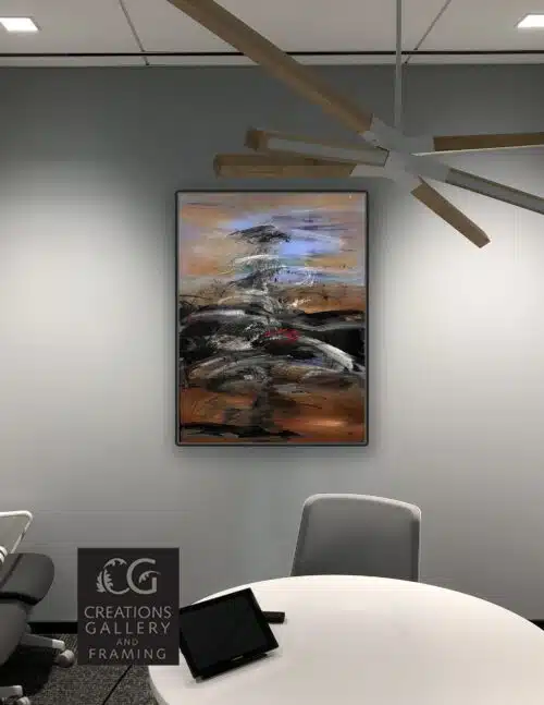 The Journey by Patricia Gagic displayed on the wall of a modern office meeting room